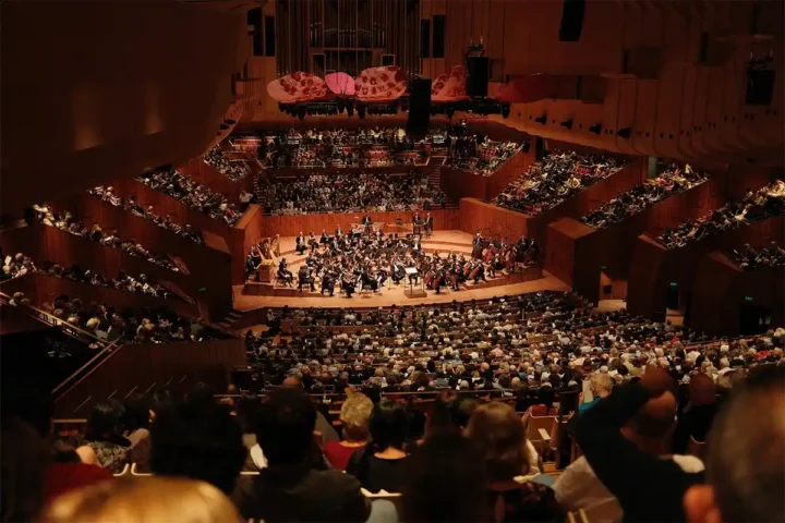 People watching a live performance at the Sydney Opera House
